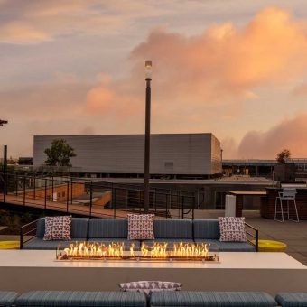 Gather and mingle around the rooftop fireplace