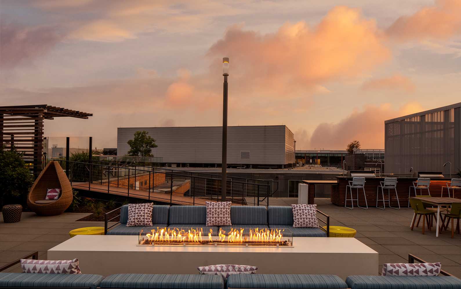 Gather and mingle around the rooftop fireplace